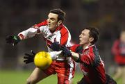 26 January 2008; Kevin McGuckin, Derry, in action against John Clarke, Down. Dr. McKenna Cup Final, Derry v Down, Casement Park, Belfast, Co. Antrim. Picture credit: Oliver McVeigh / SPORTSFILE