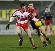 26 January 2008; Enda Muldoon, Derry, in action against Ronan Sexton, Down. Dr. McKenna Cup Final, Derry v Down, Casement Park, Belfast, Co. Antrim. Picture credit: Oliver McVeigh / SPORTSFILE
