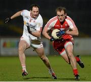 28 February 2015; Brian Og McAlary, Derry, in action against Ronan McNabb, Tyrone. Allianz Football League, Division 1, Round 3, Tyrone v Derry. Healy Park, Omagh, Co. Tyrone. Picture credit: Oliver McVeigh / SPORTSFILE
