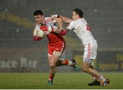 28 February 2015; Eoin Bradley, Derry, in action against Cathal McCarron, Tyrone. Allianz Football League, Division 1, Round 3, Tyrone v Derry. Healy Park, Omagh, Co. Tyrone. Picture credit: Oliver McVeigh / SPORTSFILE