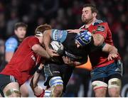 28 February 2015; Josh Strauss, Glasgow Warriors, is tackled by Sean Dougall and CJ Stander, Munster. Guinness PRO12, Round 16, Munster v Glasgow Warriors. Irish Independent Park, Cork. Picture credit: Matt Browne / SPORTSFILE