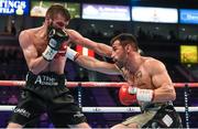 28 February 2015; Anthony Cacace, left, exchanges punches with Santiago Bustos during their Super Featherweight bout. The World Is Not Enough Undercard, Odyssey Arena, Belfast, Co. Antrim. Picture credit: Ramsey Cardy / SPORTSFILE
