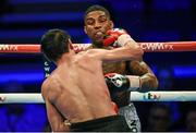 28 February 2015; Denton Vassell, right, exchanges punches with Viktor Plotnykov during their IBF Intercontinental Welterweight Championship bout. The World Is Not Enough Undercard, Odyssey Arena, Belfast, Co. Antrim. Picture credit: Stephen McCarthy / SPORTSFILE