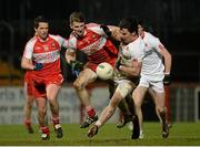 28 February 2015; Mattie Donnelly, Tyrone, in action against Niall Holly, Derry. Allianz Football League, Division 1, Round 3, Tyrone v Derry. Healy Park, Omagh, Co. Tyrone. Picture credit: Oliver McVeigh / SPORTSFILE