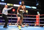 28 February 2015; Dillian Whyte is sent to a neutral corner after a heavy punch on Beka Lobjanidze during their Heavyweight bout. The World Is Not Enough Undercard, Odyssey Arena, Belfast, Co. Antrim. Picture credit: Ramsey Cardy / SPORTSFILE