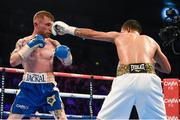 28 February 2015; Carl Frampton, left, exchanges punches with Chris Avalos during their IBF Super-Bantamweight World Title fight. The World is Not Enough, Odyssey Arena, Belfast, Co. Antrim. Picture credit: Ramsey Cardy / SPORTSFILE
