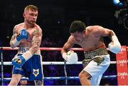 28 February 2015; Carl Frampton, right, exchanges punches with Chris Avalos during their IBF Super-Bantamweight World Title fight. The World is Not Enough, Odyssey Arena, Belfast, Co. Antrim. Picture credit: Ramsey Cardy / SPORTSFILE
