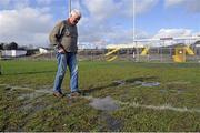 1 March 2015; Tuam Stadium groundsman Tony Melia inspects the pitch after heavy a heavy snow shower which has made the pitch unplayable. Allianz Football League, Division 2, Round 3, Galway v Laois. Tuam Stadium, Tuam, Co. Galway. Picture credit: Ray Ryan / SPORTSFILE