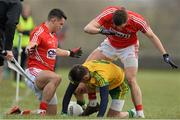 1 March 2015; Karl Lacey, Donegal, in action against Tom Clancy and Tomas Clancy, Cork. Allianz Football League, Division 1, Round 3, Donegal v Cork. Fr Tierney Park, Ballyshannon, Co. Donegal. Picture credit: Oliver McVeigh / SPORTSFILE