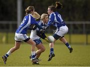1 March 2015; Caoimhe Mohan, Monaghan, in action against Joyce Dunne, left, and Laura Marie Maher, Laois. TESCO HomeGrown Ladies National Football League Division 1 Round 4, Laois v Monaghan, Crettyard GAA club, Crettyard, Co. Laois. Picture credit: Pat Murphy / SPORTSFILE