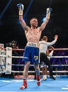 28 February 2015; Carl Frampton celebrates his victory by TKO after referee Howard Foster stops the fight in the fifth round against Chris Avalos after their IBF Super-Bantamweight World Title fight. The World is Not Enough, Odyssey Arena, Belfast, Co. Antrim. Picture credit: Ramsey Cardy / SPORTSFILE