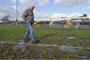 1 March 2015; Tuam Stadium groundsman Tony Melia inspects the pitch after heavy a heavy snow shower which has made the pitch unplayable. Allianz Football League, Division 2, Round 3, Galway v Laois. Tuam Stadium, Tuam, Co. Galway. Picture credit: Ray Ryan / SPORTSFILE