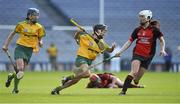 1 March 2015; Aoife Donohue, supported by her Mullagh team mate and captain Colette Glennon, left,  in action against Mary Leacy, Oulart-The Ballagh. AIB All Ireland Senior Club Camogie Final, Mullagh v Oulart-The Ballagh. Croke Park, Dublin. Picture credit: Ray McManus / SPORTSFILE