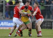 1 March 2015; Frank McGlynn, Donegal, in action against Tom Clancy, Tomas Clancy and Brian Hurley, Cork. Allianz Football League, Division 1, Round 3, Donegal v Cork. Fr Tierney Park, Ballyshannon, Co. Donegal. Picture credit: Oliver McVeigh / SPORTSFILE