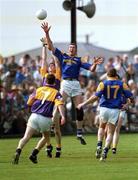 7 May 2000; Tom Howlin of Wexford in action against Aidan Kehoe of Longford during the Bank of Ireland Leinster Senior Football Championship Group Stage Round 1 match between Wexford and Longford at O'Kennedy Park in New Ross, Wexford. Photo by Aoife Rice/Sportsfile