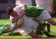 28 April 2000; Paul Hodgson of England dives over to score a try, despite being tackled by David Kelly of Ireland, during the 4 Nations U18 Championship match between Ireland and England at Lansdown Road in Dublin. Photo by Matt Browne/Sportsfile