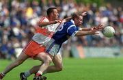 14 May 2000; Anthony Forde of Cavan in action Dermot Dougan of Derry during the Bank of Ireland Ulster Senior Football Championship Quarter-Final match between Cavan and Derry at Breffni Park in Cavan. Photo by David Maher/Sportsfile