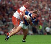 14 May 2000; Barry Lynch of Cavan in action against Geoffrey McGonagle of Derry during the Bank of Ireland Ulster Senior Football Championship Quarter-Final match between Cavan and Derry at Breffni Park in Cavan. Photo by David Maher/Sportsfile