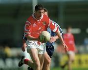 9 April 2000; Bernie Collins of Cork in action against Paul Curran of Dublin during the Church & General National Football League Division 1A match between Dublin and Cork at Parnell Park in Dublin. Photo by Aoife Rice/Sportsfile