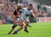 12 March 2000; Brian Flannery of Waterford in action against Kevin Power of Kilkenny during the Church & General National Hurling League Division 1B match between Kilkenny and Waterford at Nowlan Park in Kilkenny. Photo by Ray McManus/Sportsfile