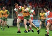 14 May 1995; Brian Murray of Donegal in action against Brian McGilligan of Derry during the Church & General National Football League Final match between Derry and donegal at Croke Park in Dublin. Photo by David Maher/Sportsfile