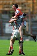 7 May 2000; Brian Philips of Louth, right,  celebrates with team-mates goalkeepper Colm Nally and Stephen Melia, behind, following their side's victory during the Church & General National Football League Division 2 Final match between Louth and Offaly at Croke Park in Dublin. Photo by Brendan Moran/Sportsfile