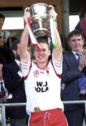 13 May 2000; Tyrone captain Cormac McAnallen lifts the Tadhg O'Cleirigh Cup following his side's victory during the All-Ireland U21 Football Championship Final match between Tyrone and Limerick at Cusack Park in Mullingar, Westmeath. Photo by Ray McManus/Sportsfile