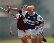 7 May 2000; Cyril Cuddy of Laois in action against Alfie Devine of Westmeath during the Guinness Leinster Senior Hurling Championship Round Robin match between Westmeath and Laois at Cusack Park in Mullingar, Westmeath. Photo by Damien Eagers/Sportsfile