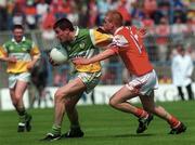 7 May 2000; Ciaran McManus of Offaly in action against JP Rooney of Louth during the Church & General National Football League Division 2 Final match between Louth and Offaly at Croke Park in Dublin. Photo by Ray Lohan/Sportsfile
