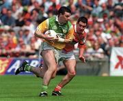 7 May 2000; Cillian Farrell of Offaly in action against Peter McGinnity of Louth during the Church & General National Football League Division 2 Final match between Louth and Offaly at Croke Park in Dublin. Photo by Brendan Moran/Sportsfile