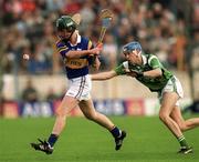 30 April 2000; David Kennedy of Tipperary in action against Mike O'Brien of Limerick during the Church & General National Hurling League Division 1 Semi-Final match between Tipperary and Limerick at Semple Stadium in Thurles, Tipperary. Photo by Ray McManus/Sportsfile