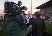 2 May 2000; Munster head coach Declan Kidney is interviewed during a Munster Rugby training session at Thomond Park in Limerick. Photo by Brendan Moran/Sportsfile