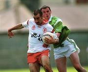 13 May 2000; Declan McCrossan of Tyrone in action against Brian Geary of Limerick during the All-Ireland U21 Football Championship Final match between Tyrone and Limerick at Cusack Park in Mullingar, Westmeath. Photo by Damien Eagers/Sportsfile