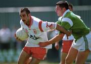13 May 2000; Declan McCrossan of Tyrone in action against Pat Ahern of Limerick during the All-Ireland U21 Football Championship Final match between Tyrone and Limerick at Cusack Park in Mullingar, Westmeath. Photo by Damien Eagers/Sportsfile
