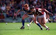 14 May 2000; Declan Ryan of Tipperary in action against Cathal Moore of Galway during the Church & General National Hurling League Final match between Tipperary and Galway at the Gaelic Grounds in Limerick. Photo by Brendan Moran/Sportsfile