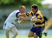 14 May 2000; Denis O'Driscoll of Clare in action against Matt Kiely of Waterford during the Bank of Ireland Munster Senior Football Championship Quarter-Final match between Clare and Waterford at Cusack Park in Ennis, Clare. Photo by Ray McManus/Sportsfile