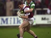 26 April 2000; Dessie Dolan of Westmeath in action against Mark O'Riordon of Limerick during the All-Ireland Under 21 Football Championship Semi-Final match between Limerick and Westmeath at O'Moore Park in Porlaoise, Laois. Photo by Damien Eagers/Sportsfile