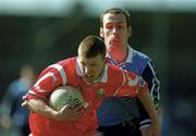 9 April 2000; Donagh Wiseman of Cork in action against Ian Robertson of Dublin during the Church & General National Football League Division 1A match between Dublin and Cork at Parnell Park in Dublin. Photo by Brendan Moran/Sportsfile
