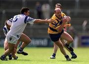 14 May 2000; Donal O'Sullivan of Clare in action against Ciaran Whelan of Waterford during the Bank of Ireland Munster Senior Football Championship Quarter-Final match between Clare and Waterford at Cusack Park in Ennis, Clare. Photo by Ray McManus/Sportsfile