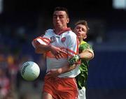 7 May 2000; ƒamonn Burns of Derry in action against Cormac Murphy of Meath during the Church & General National Football League Final between Derry and Meath at Croke Park in Dublin. Photo by Ray Lohan/Sportsfile