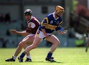 14 May 2000; Eamonn Corcoran of Tipperary in action against Joe Rabbitte of Galway during the Church & General National Hurling League Final match between Tipperary and Galway at the Gaelic Grounds in Limerick. Photo by Brendan Moran/Sportsfile