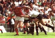 6 May 2000; Eddie Halvey of Munster is tackled by Franck Belot of Toulouse during the Heineken Cup Semi-Final match between Toulouse and Munster at the Stade du Parc Lescure in Bordeaux, France. Photo by Matt Browne/Sportsfile