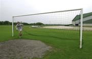 4 May 2000; Eddie Halvey fetches a ball from a soccer goal during a Munster Rugby squad training session in Bordeaux, France. Photo by Brendan Moran/Sportsfile