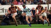 12 March 2000; Eoin Bennett of Waterford races clear of Sean Meally, right, and Noel Hickey of Kilkenny during the Church & General National Hurling League Division 1B match between Kilkenny and Waterford at Nowlan Park in Kilkenny. Photo by Ray McManus/Sportsfile