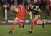 20 May 2000; Eoin Sexton of Cork in action against Timmy Carroll of Limerick during the Bank of Ireland Munster Senior Football Championship Quarter-Final match between Limerick and Cork at Fitzgerald Park in Kilmallock, Limerick. Photo by Damien Eagers/Sportsfile