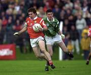 20 May 2000; Eoin Sexton of Cork in action against Conor Mullane of Limerick during the Bank of Ireland Munster Senior Football Championship Quarter-Final match between Limerick and Cork at Fitzgerald Park in Kilmallock, Limerick. Photo by Damien Eagers/Sportsfile