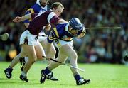 14 May 2000; Eugene O'Neill of Tipperary in action against Rory Gantley of Galway during the Church & General National Hurling League Final match between Tipperary and Galway at the Gaelic Grounds in Limerick. Photo by Brendan Moran/Sportsfile