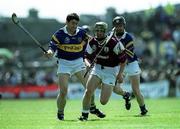 14 May 2000; Fergal Healy of Galway in action against Liam Sheedy of Tipperary during the Church & General National Hurling League Final match between Tipperary and Galway at the Gaelic Grounds in Limerick. Photo by Brendan Moran/Sportsfile