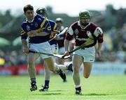 14 May 2000; Fergal Healy of Galway in action against Liam Sheedy of Tipperary during the Church & General National Hurling League Final match between Tipperary and Galway at the Gaelic Grounds in Limerick. Photo by Brendan Moran/Sportsfile