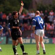 14 May 2000; Referee Brian White shows a red card to Fintan Cahill of Cavan during the Bank of Ireland Ulster Senior Football Championship Quarter-Final match between Cavan and Derry at Breffni Park in Cavan. Photo by David Maher/Sportsfile